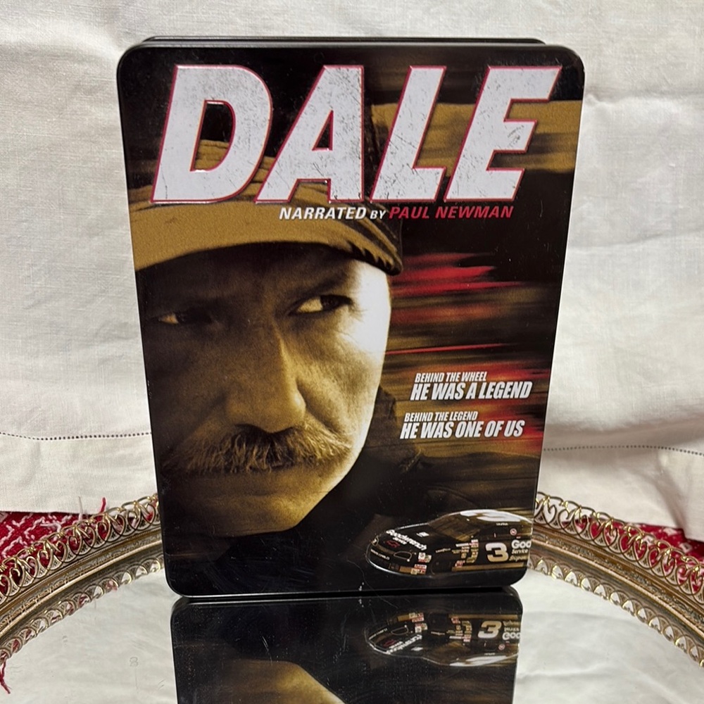 Collector’s tin containing a 6-disc DVD set of the film "Dale" -Dale Earnhardt
8